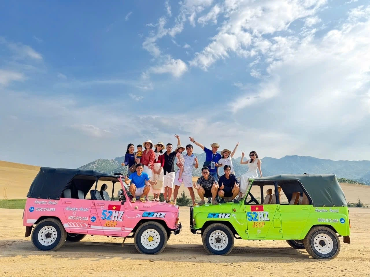 The company team with two jeeps at the sand dunes